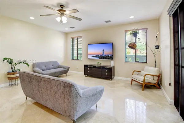 a living room with furniture and a large window