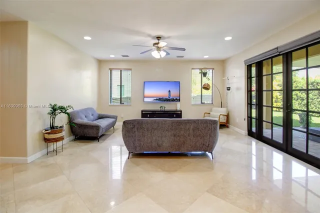 a view of a dining room with furniture and front door