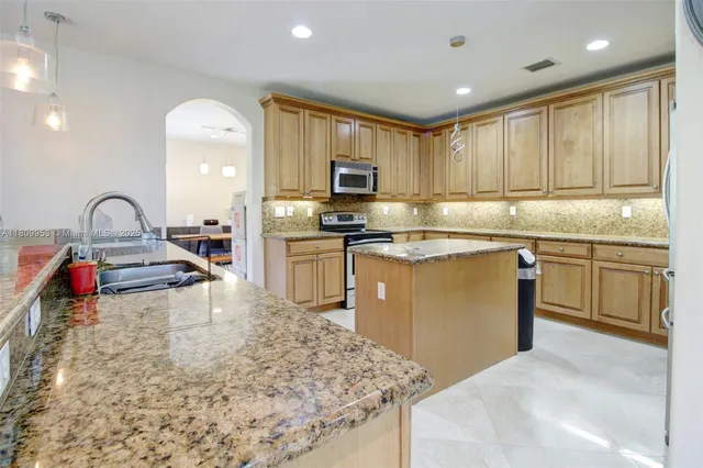 a view of backyard with swimming pool and green space