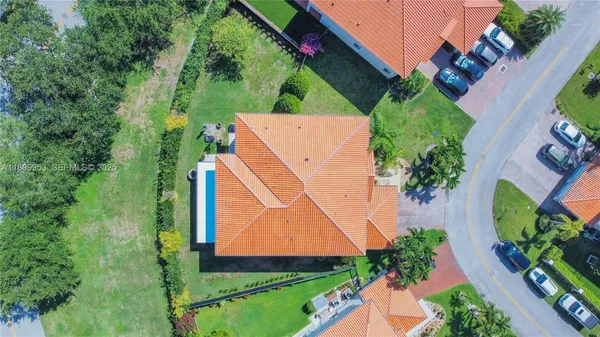 an aerial view of lake and houses with outdoor space