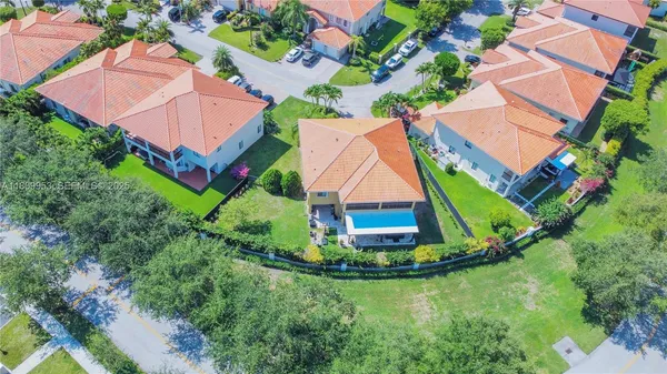 an aerial view of house with yard swimming pool and outdoor seating