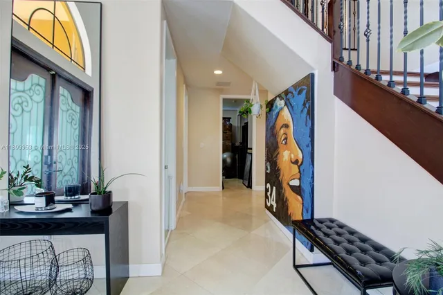 a view of hallway with furniture and entryway