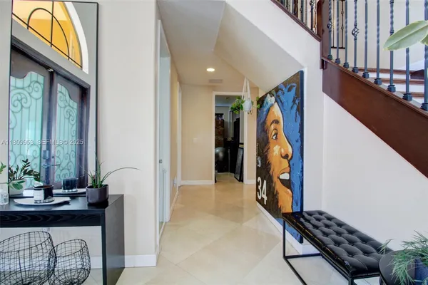 a view of hallway with furniture and entryway