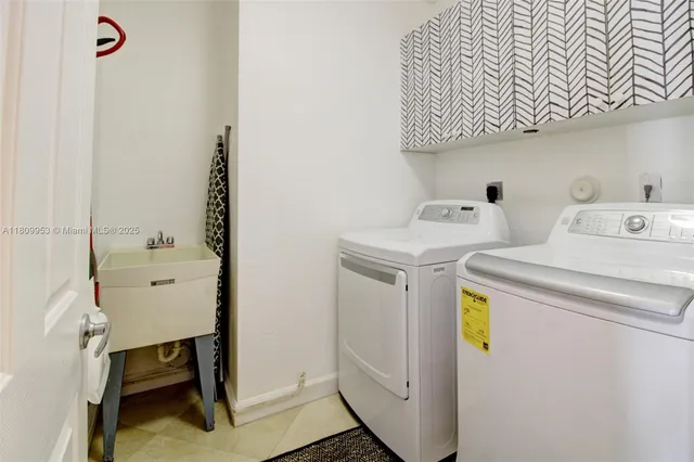 a utility room with dryer and washer