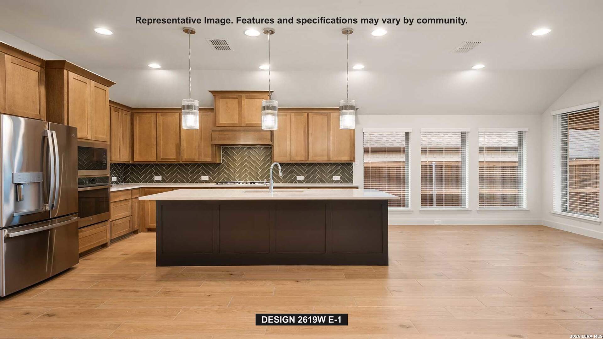 323 Bella Rosa Way Cibolo, TX 78108 - Photo 2 of 15 a large kitchen with kitchen island a sink stainless steel appliances and cabinets