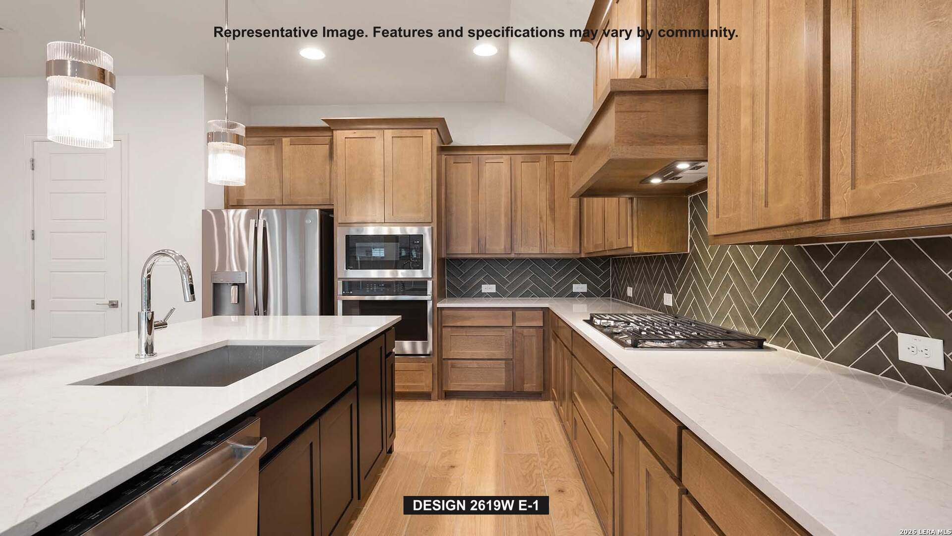 323 Bella Rosa Way Cibolo, TX 78108 - Photo 6 of 15 a kitchen with a sink stove and cabinets