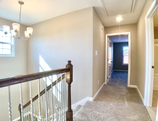 a view of a hallway to a bedroom