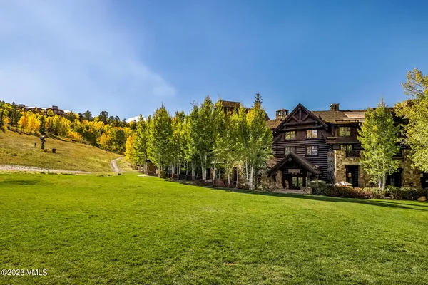 a view of a house with a big yard