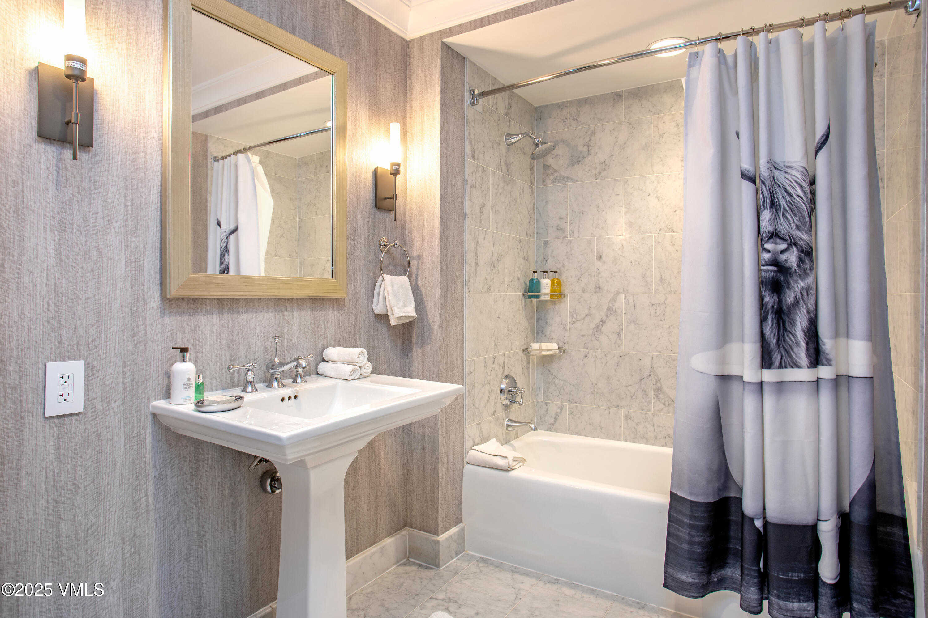100 Bachelor Ridge Road, Unit 3314 Avon, CO 81620 - Photo 23 of 58 a bathroom with a sink a mirror and a bathtub