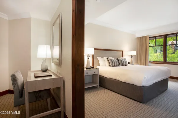 a bedroom with a bed and a couch