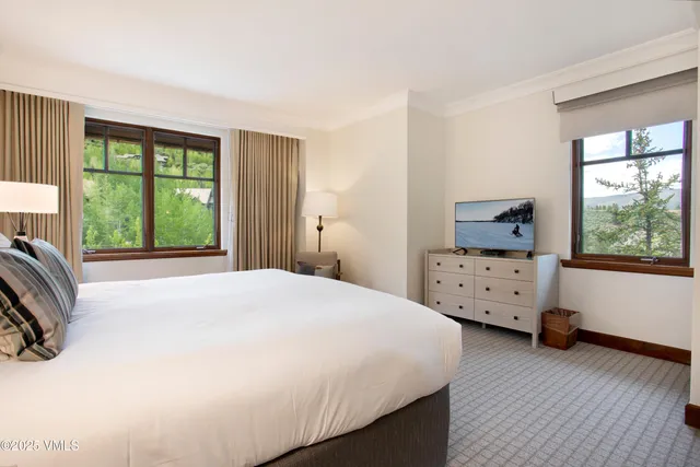 a bathroom with a glass door shower