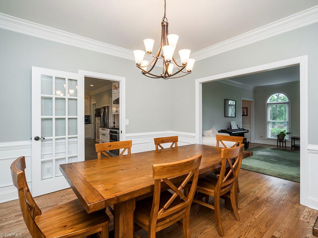 5001 Leadenhall Road Oak Ridge, NC 27310 - Photo 6 of 30 Dining room off kitchen complete with wainscoting and chair rail molding!