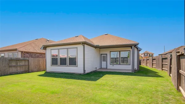a view of a house with a yard and porch