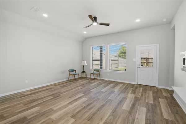 a bedroom with a bed and a workspace