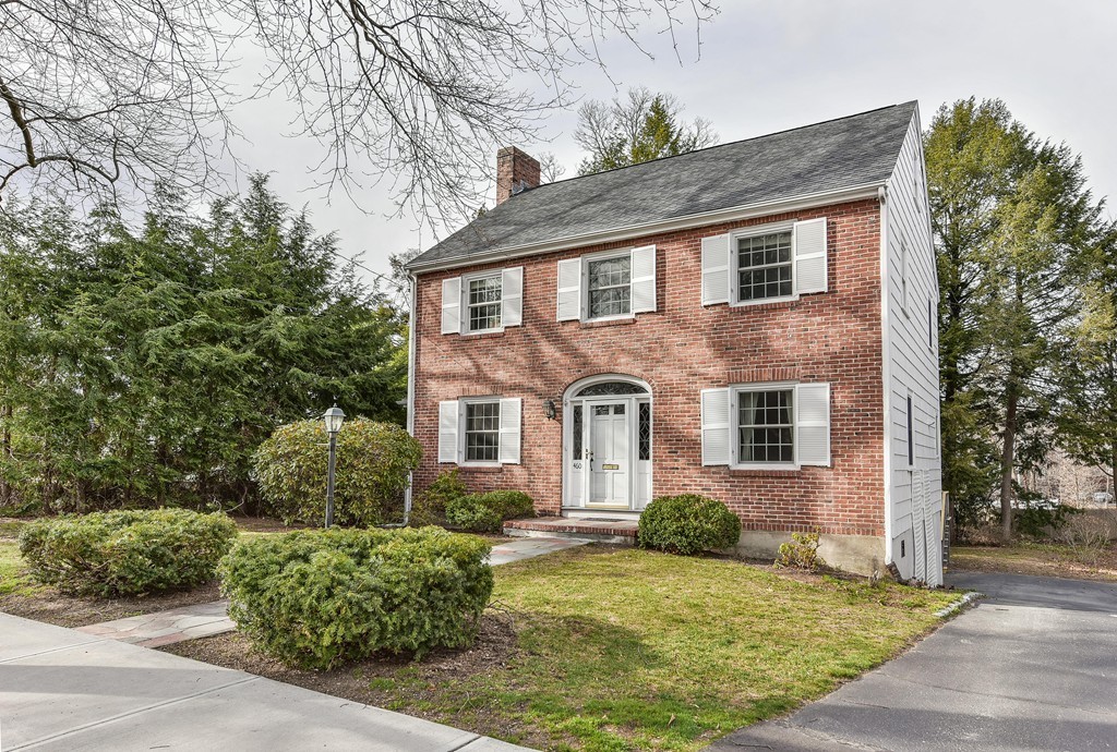 460 Brook Road Milton, MA 02186 - Photo 13 of 14 a front view of a house with a yard garage and outdoor seating