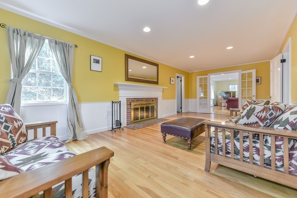 460 Brook Road Milton, MA 02186 - Photo 8 of 14 a living room with furniture fireplace and flat screen tv