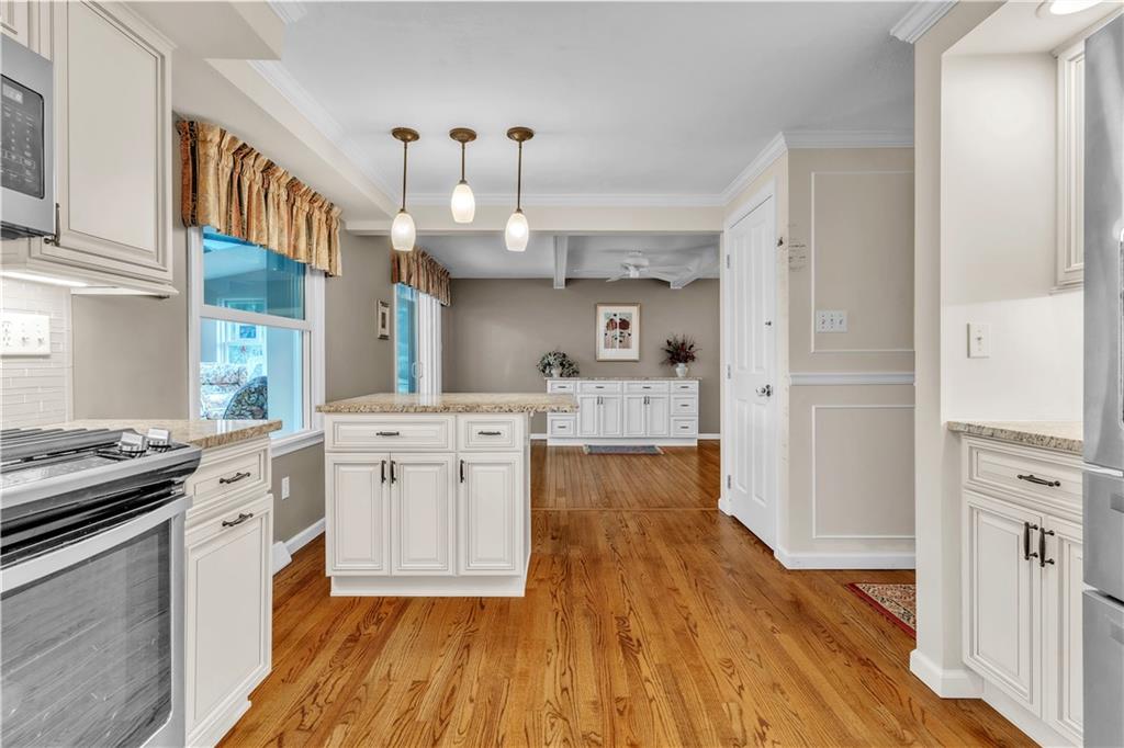 5100 West Harbison Road Pittsburgh, PA 15205 - Photo 8 of 49 Island with overhead pendent lighting extends the entertaining options