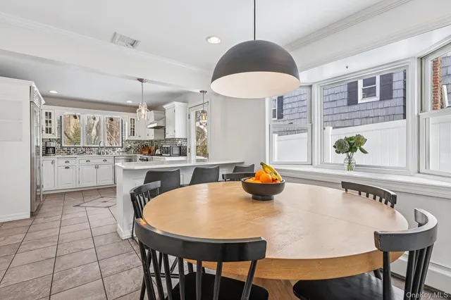 a dining room with furniture and window