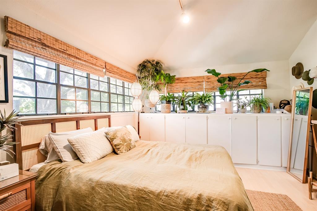 2400 Thornton Road, Unit A Austin, TX 78704 - Photo 10 of 13 Bedroom with vaulted ceiling and light wood finished floors