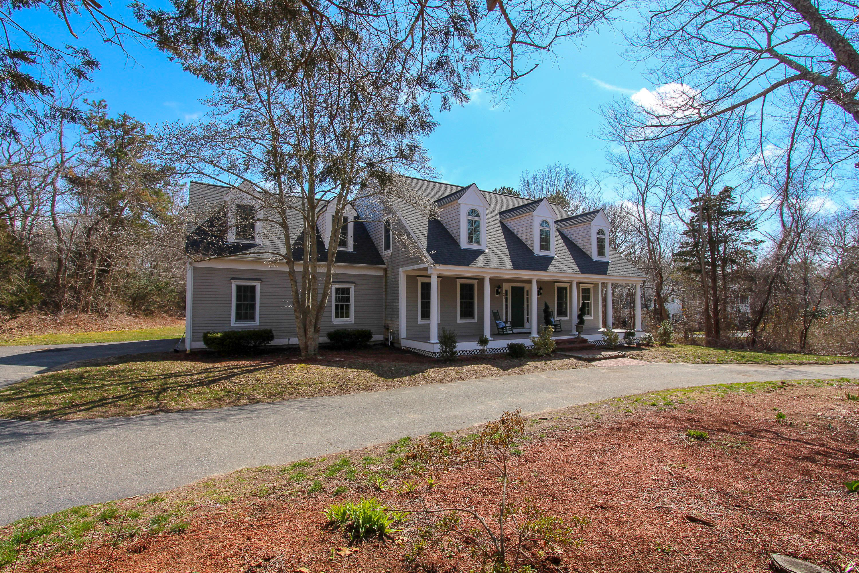 29 Schooner Drive Cotuit, MA 02635 - Photo 1 of 35 a view of a house with a yard covered in snow