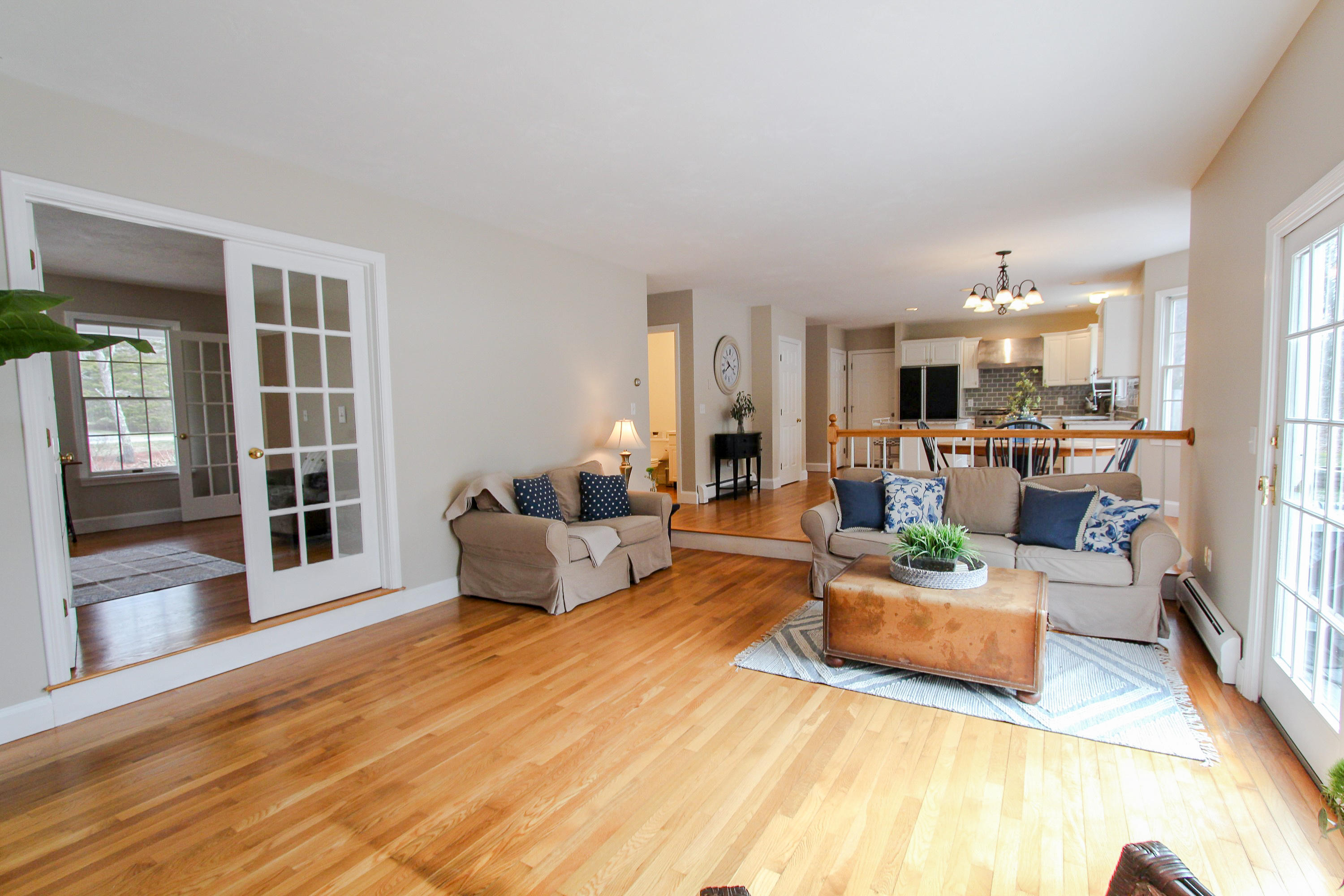 29 Schooner Drive Cotuit, MA 02635 - Photo 14 of 35 a living room with furniture and a chandelier