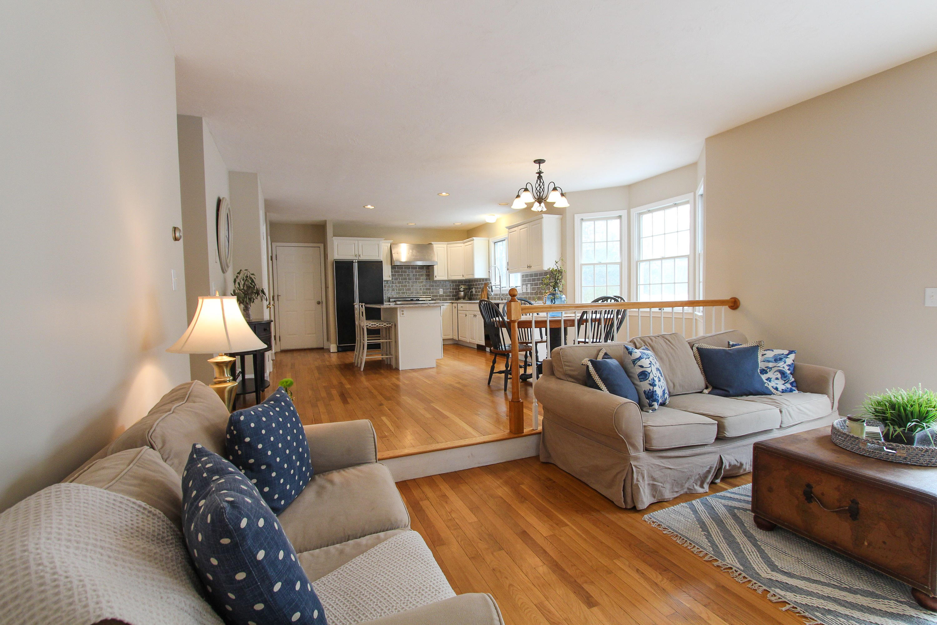 29 Schooner Drive Cotuit, MA 02635 - Photo 15 of 35 a living room with furniture and a chandelier