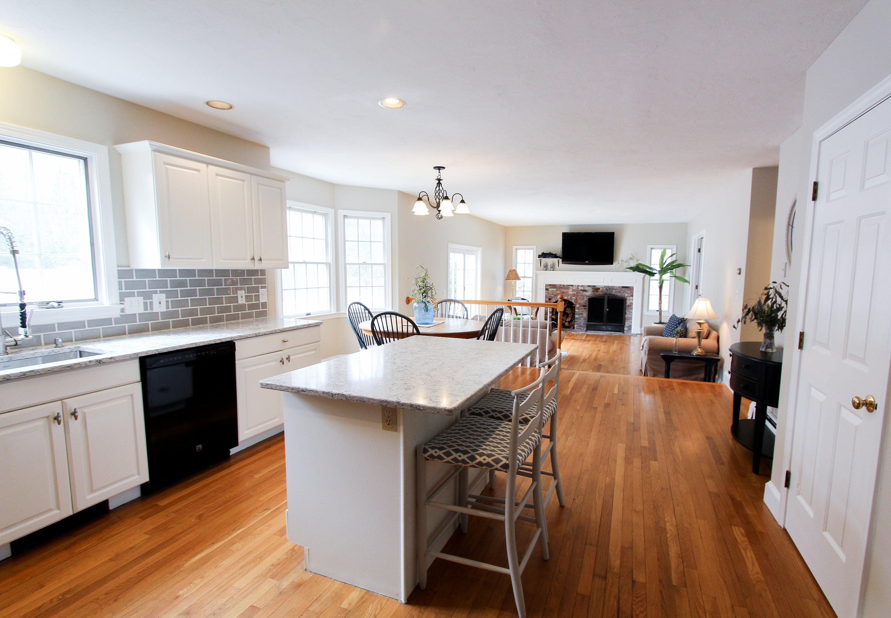 29 Schooner Drive Cotuit, MA 02635 - Photo 35 of 35 a large kitchen with a table chairs refrigerator and microwave