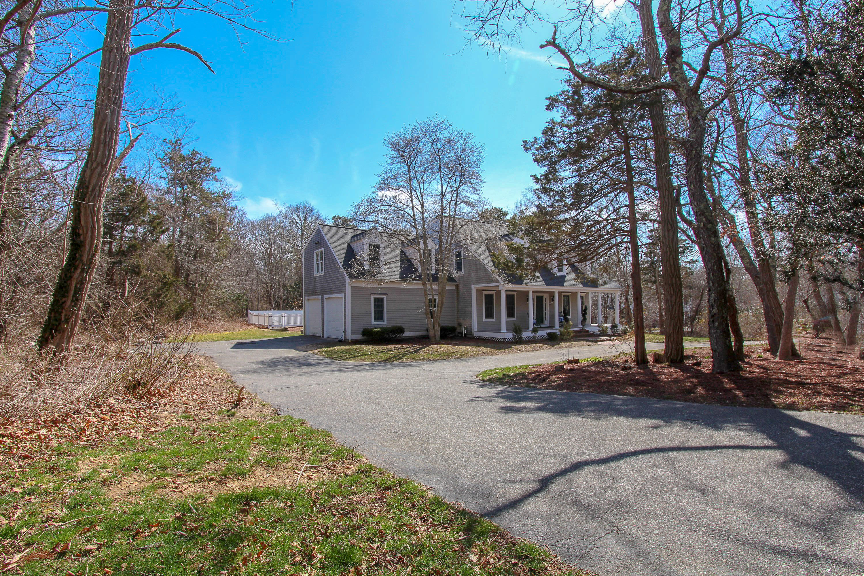 29 Schooner Drive Cotuit, MA 02635 - Photo 34 of 35 a front view of a house with a yard and tree s