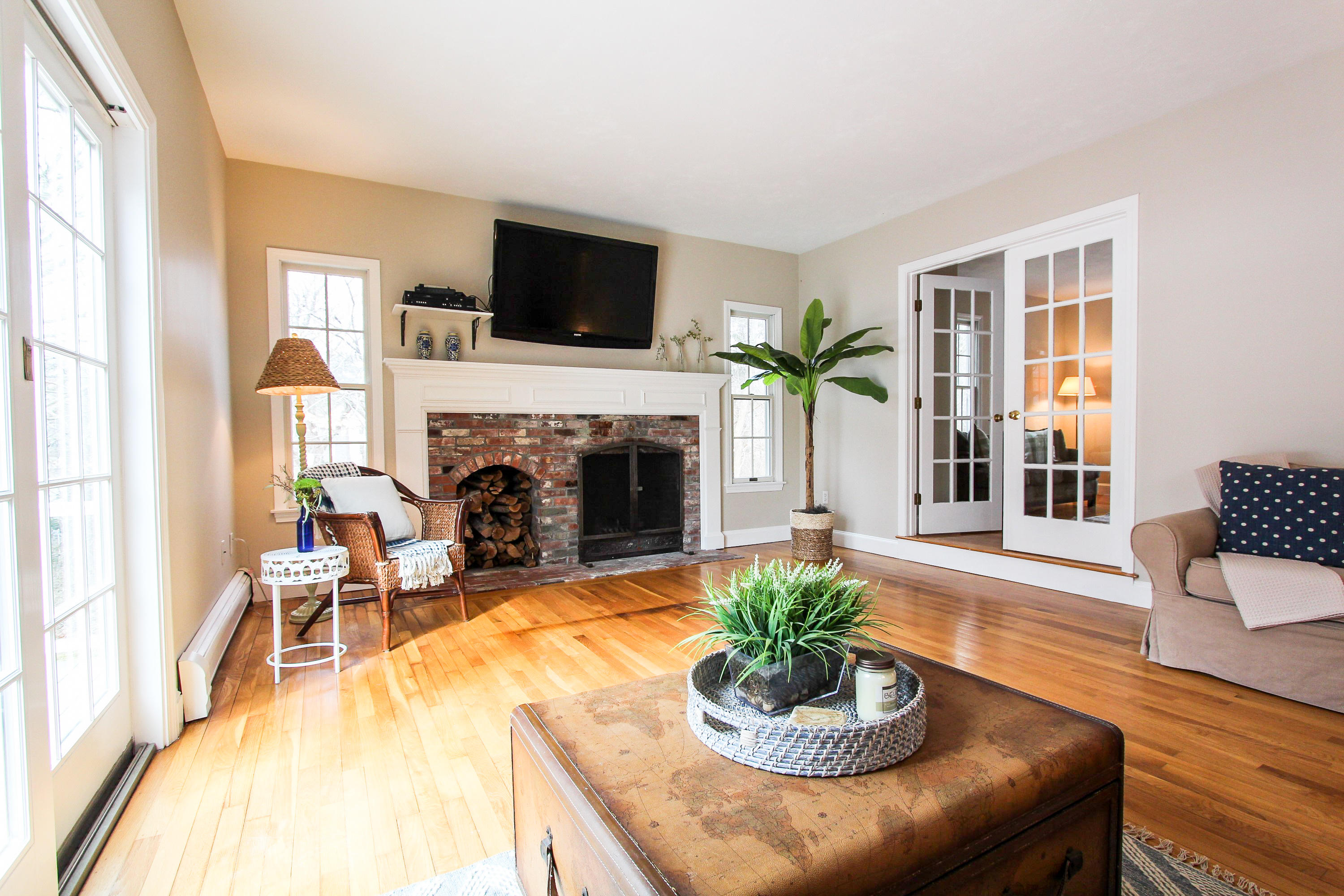 29 Schooner Drive Cotuit, MA 02635 - Photo 3 of 35 a living room with furniture a fireplace and a flat screen tv