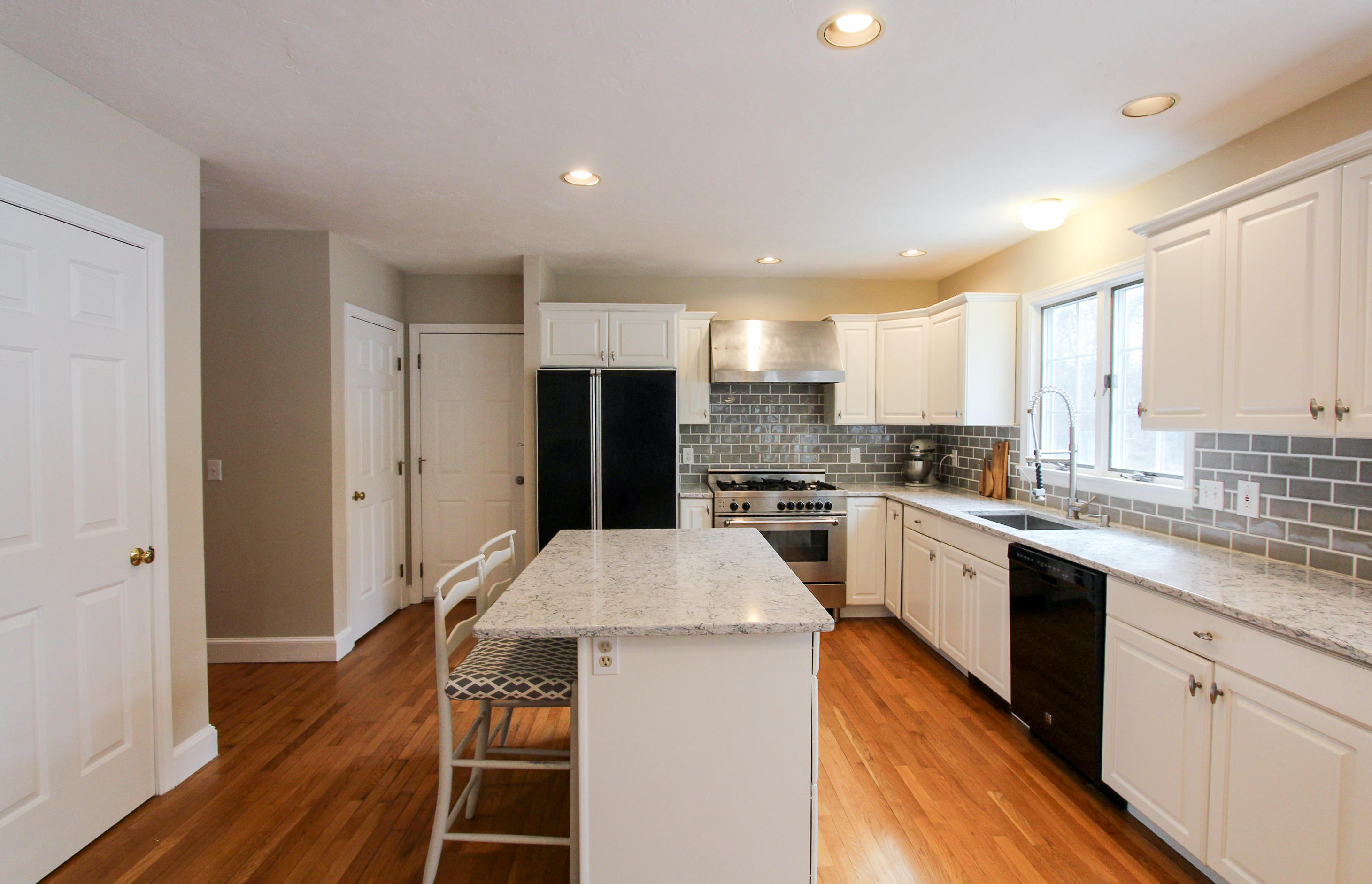 29 Schooner Drive Cotuit, MA 02635 - Photo 7 of 35 a kitchen with a sink stove and refrigerator
