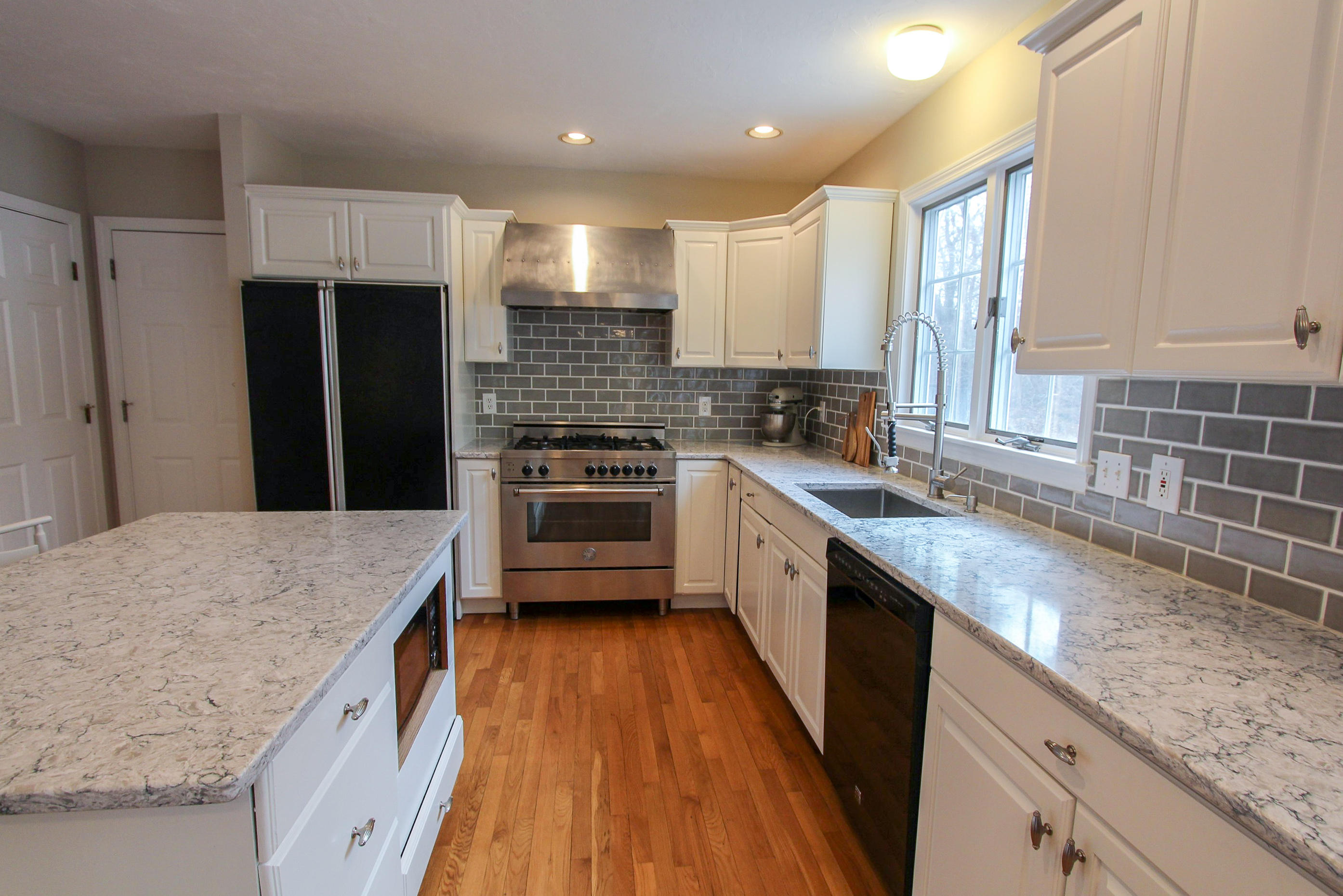 29 Schooner Drive Cotuit, MA 02635 - Photo 8 of 35 a kitchen with a sink stove top oven and refrigerator