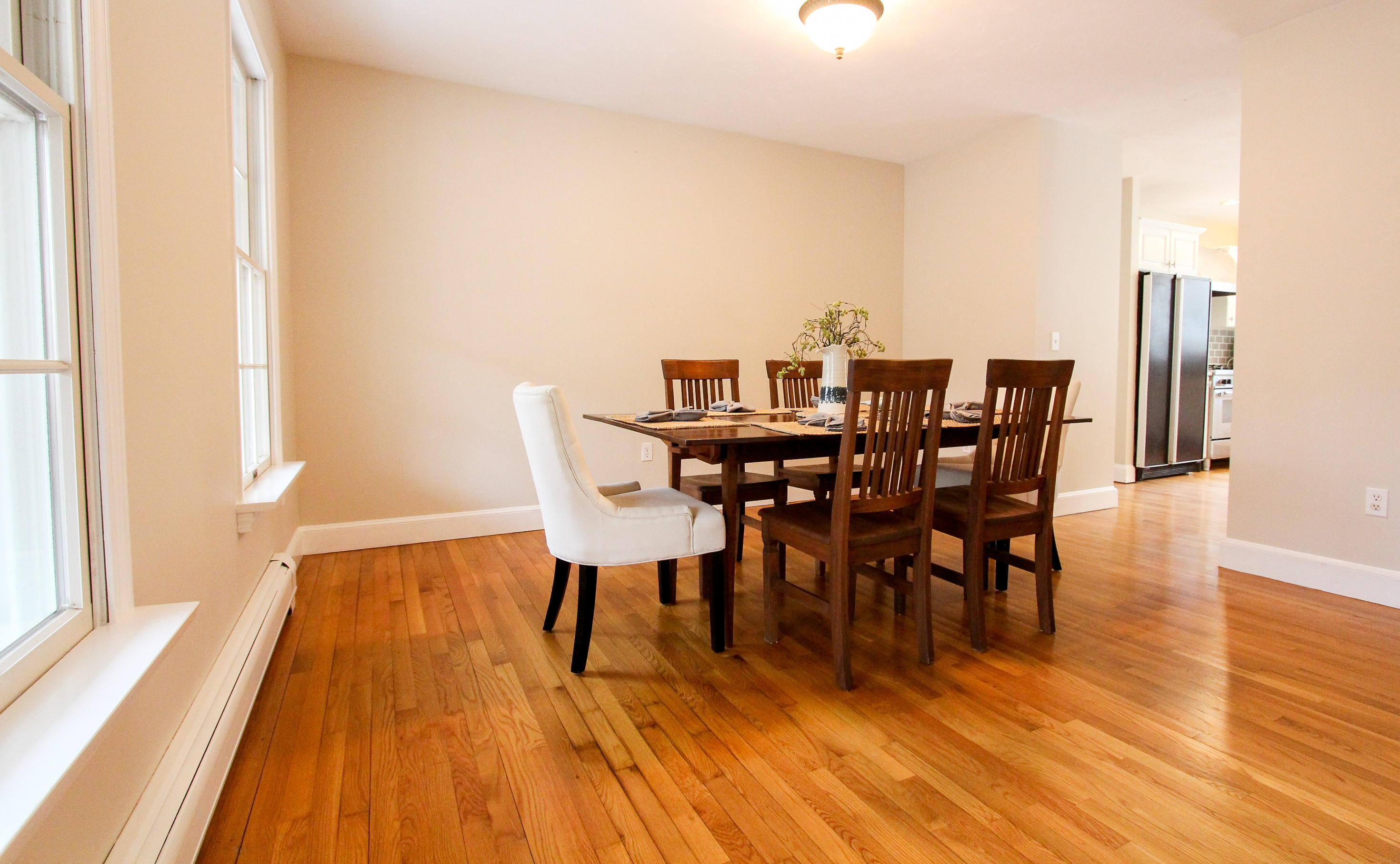 29 Schooner Drive Cotuit, MA 02635 - Photo 9 of 35 a view of a dining room with furniture and wooden floor