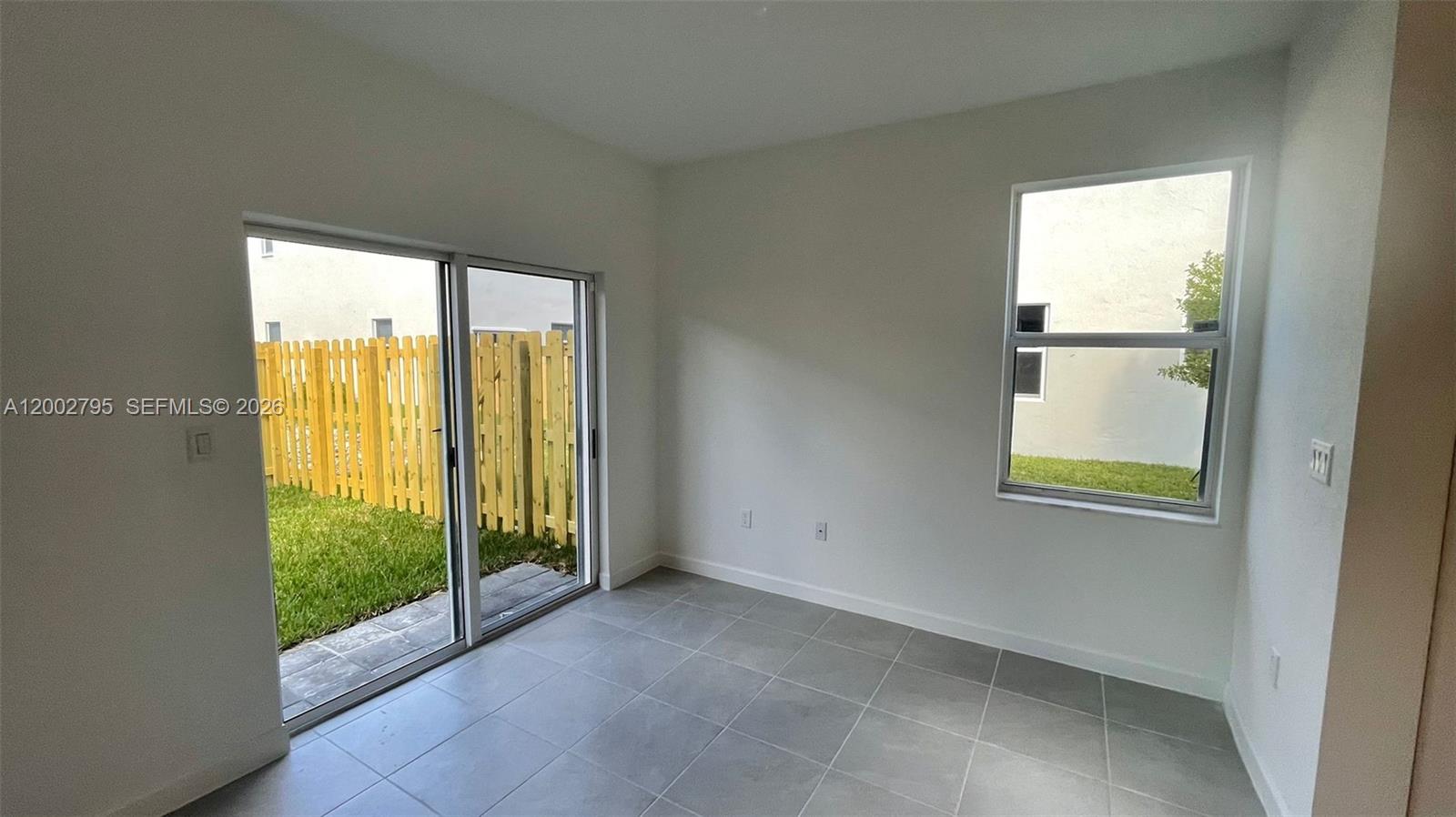 1844 Southeast 27th Street Homestead, FL 33035 - Photo 5 of 23 a view of an empty room with a window