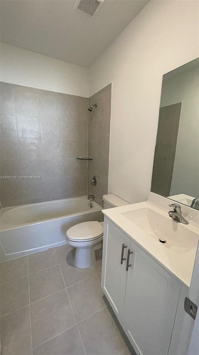 1844 Southeast 27th Street Homestead, FL 33035 - Photo 8 of 23 a bathroom with a sink a toilet and shower