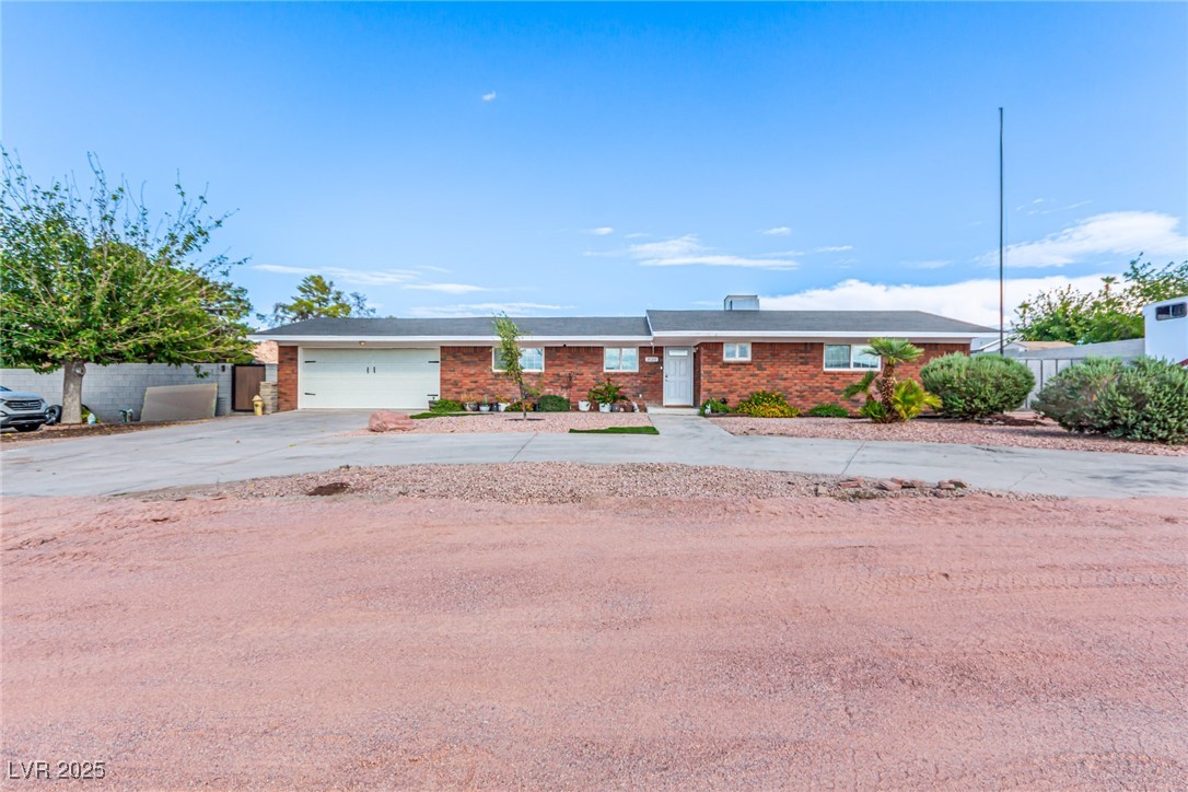 2120 Thoroughbred Road Henderson, NV 89002 - Photo 7 of 57 Ranch-style house with driveway, brick siding, and an attached 2 car garage. NO HOA, RV parking