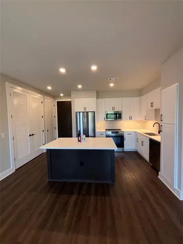 a view of kitchen with wooden floor