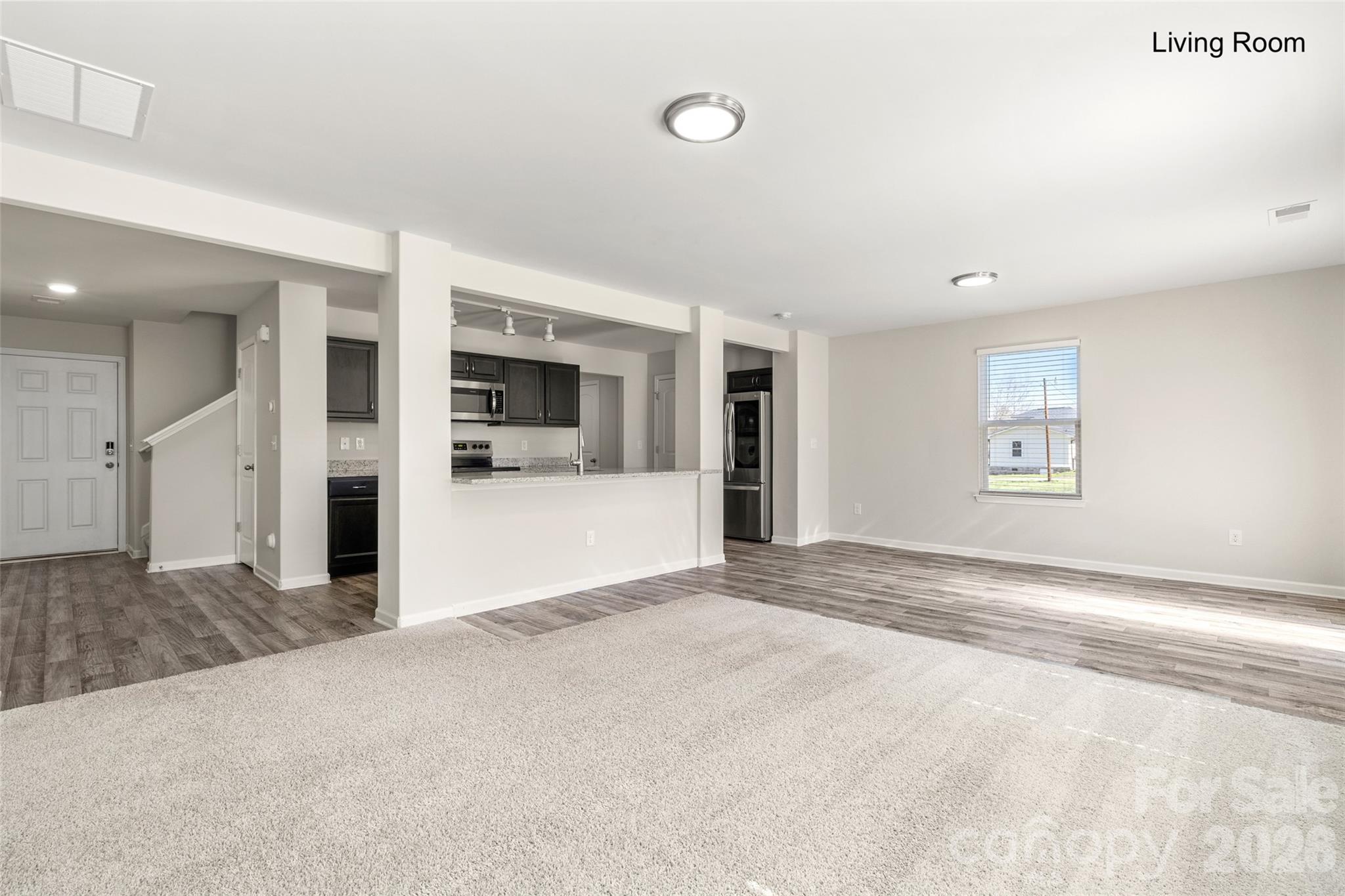 463 West Barr Street Lancaster, SC 29720 - Photo 19 of 43 a view of a big room with windows and chandelier
