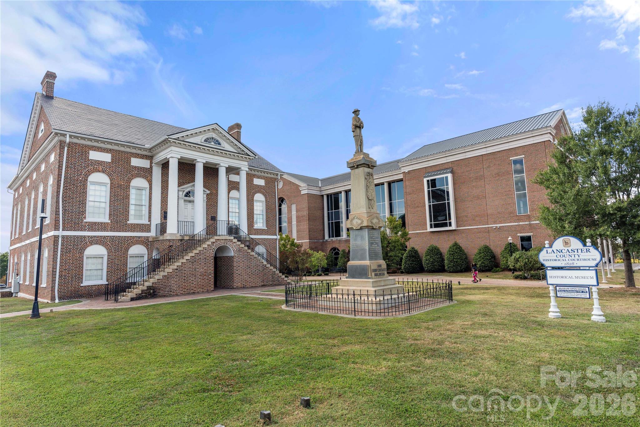 463 West Barr Street Lancaster, SC 29720 - Photo 34 of 43 a front view of a house with garden and patio