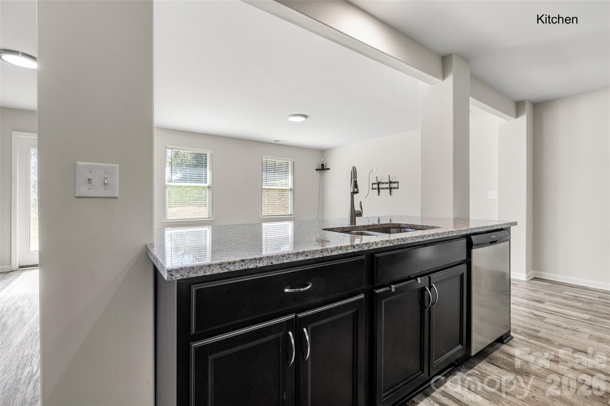 463 West Barr Street Lancaster, SC 29720 - Photo 6 of 43 a kitchen with granite countertop a sink and cabinets