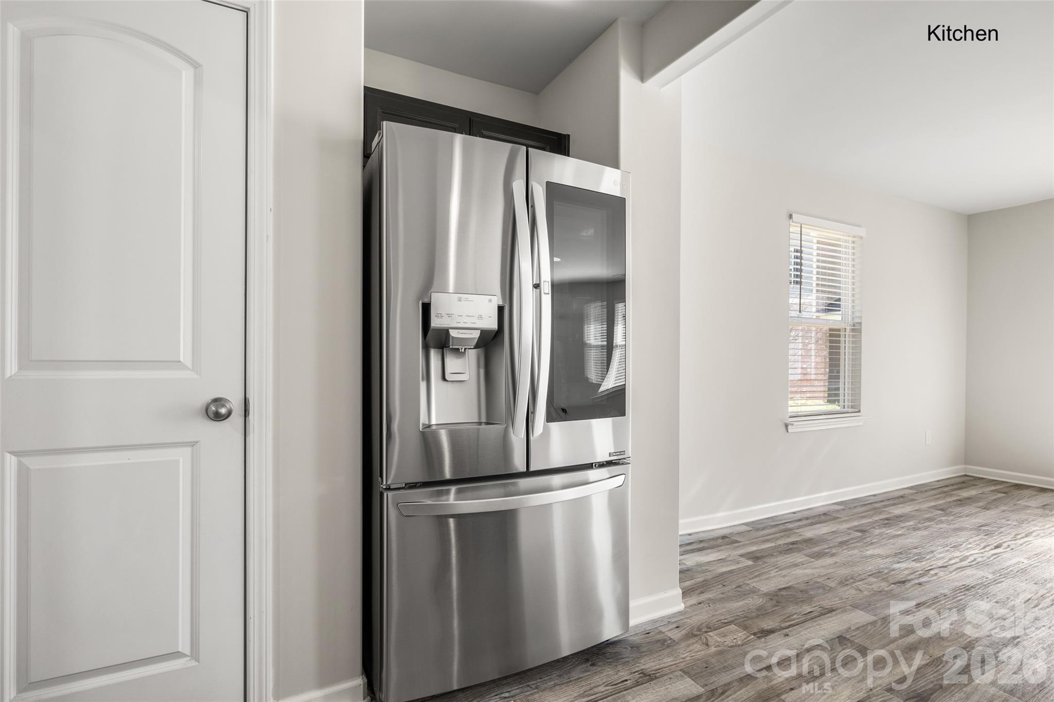 463 West Barr Street Lancaster, SC 29720 - Photo 7 of 43 a view of a kitchen with wooden floor and refrigerator
