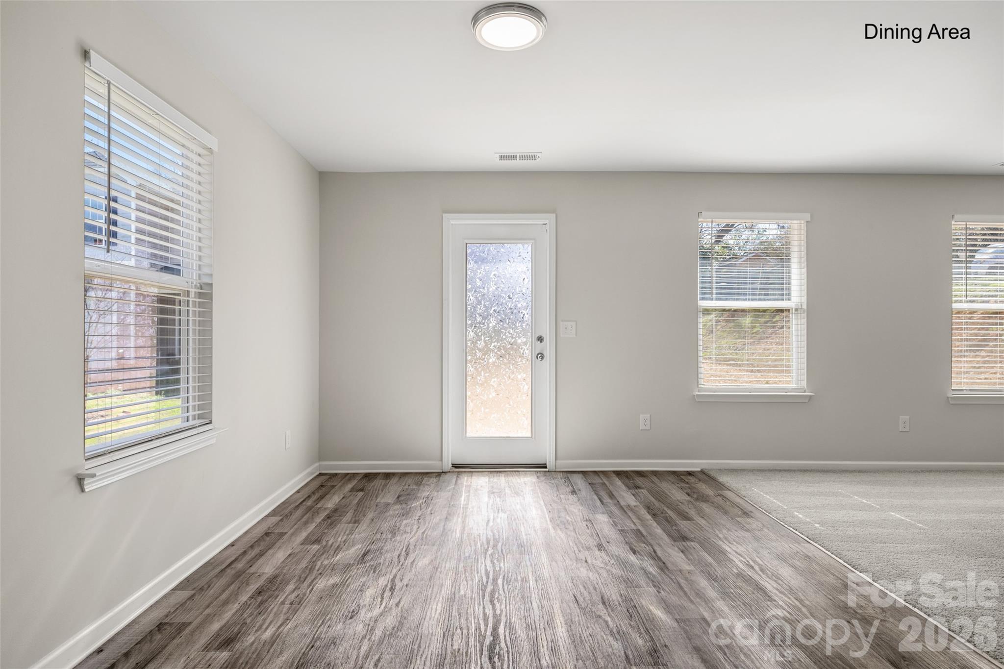 463 West Barr Street Lancaster, SC 29720 - Photo 8 of 43 a view of an empty room with wooden floor and a window