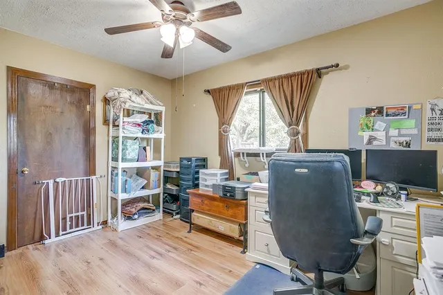 a work room with furniture and a window