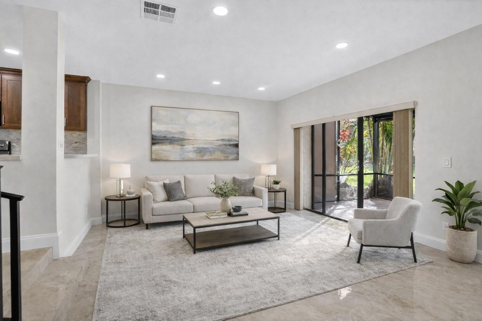 a living room with furniture and large window