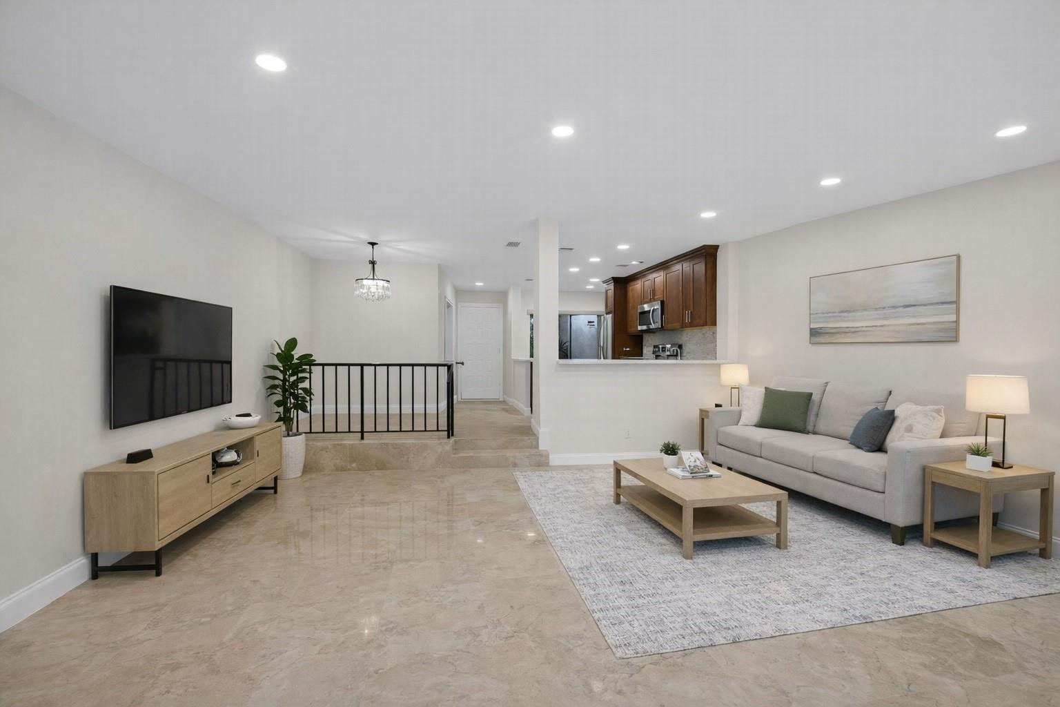 21476 Juego Circle, Unit 8C Boca Raton, FL 33433 - Photo 14 of 54 a living room with furniture and a flat screen tv
