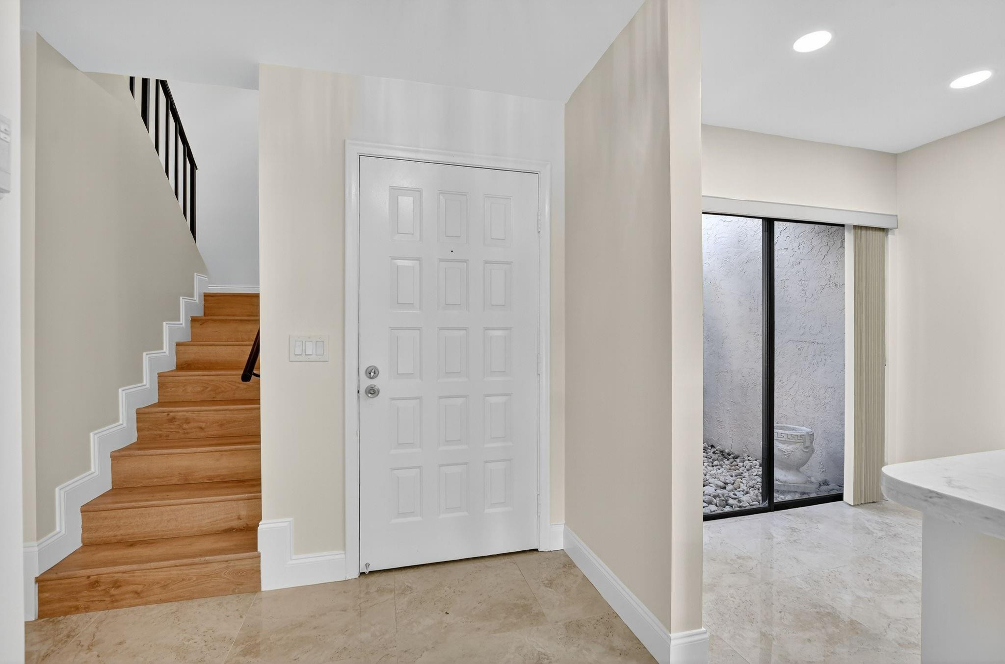 21476 Juego Circle, Unit 8C Boca Raton, FL 33433 - Photo 18 of 54 a view of an entryway with staircase