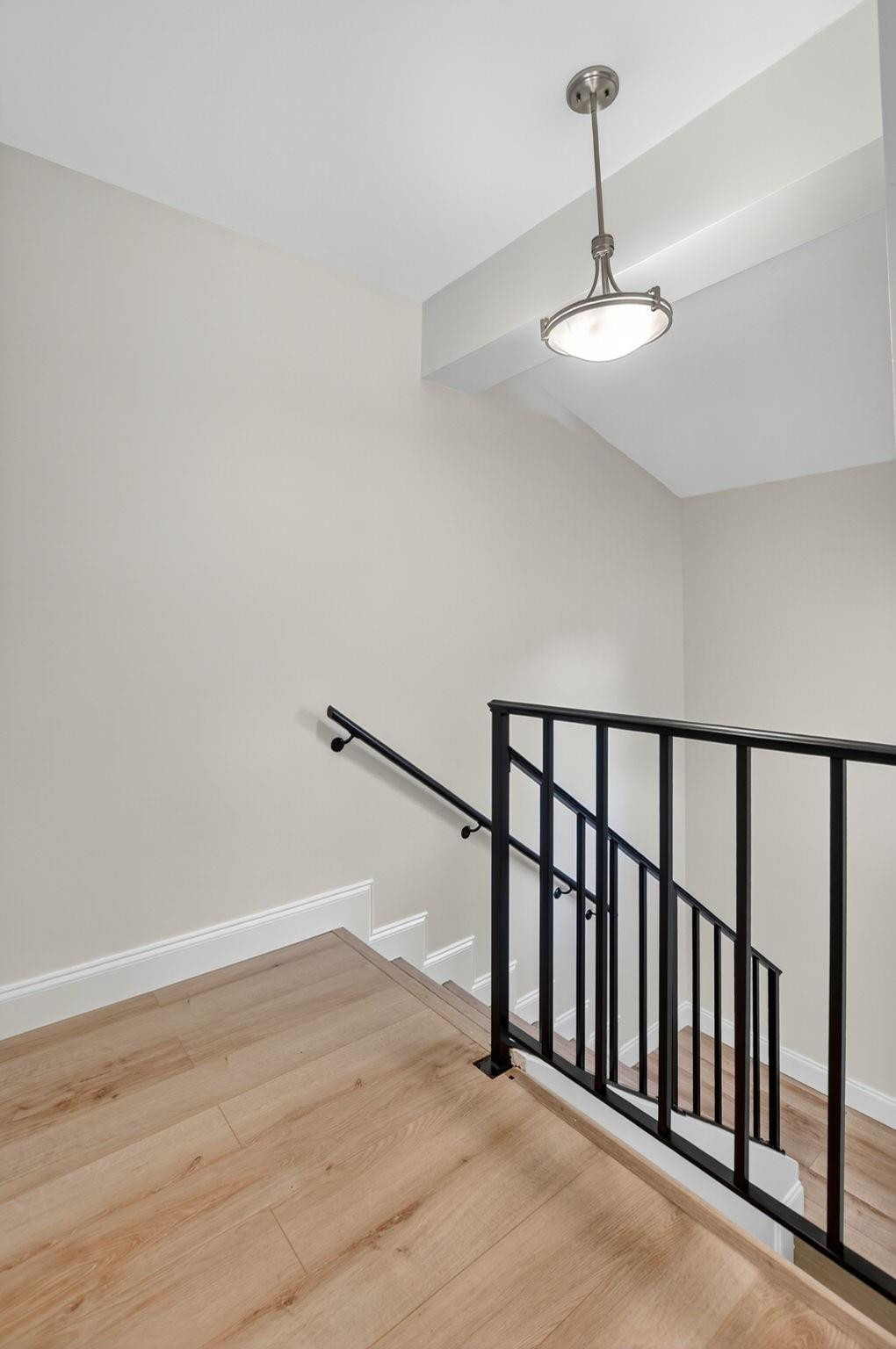 21476 Juego Circle, Unit 8C Boca Raton, FL 33433 - Photo 21 of 54 a view of staircase with ceiling fan