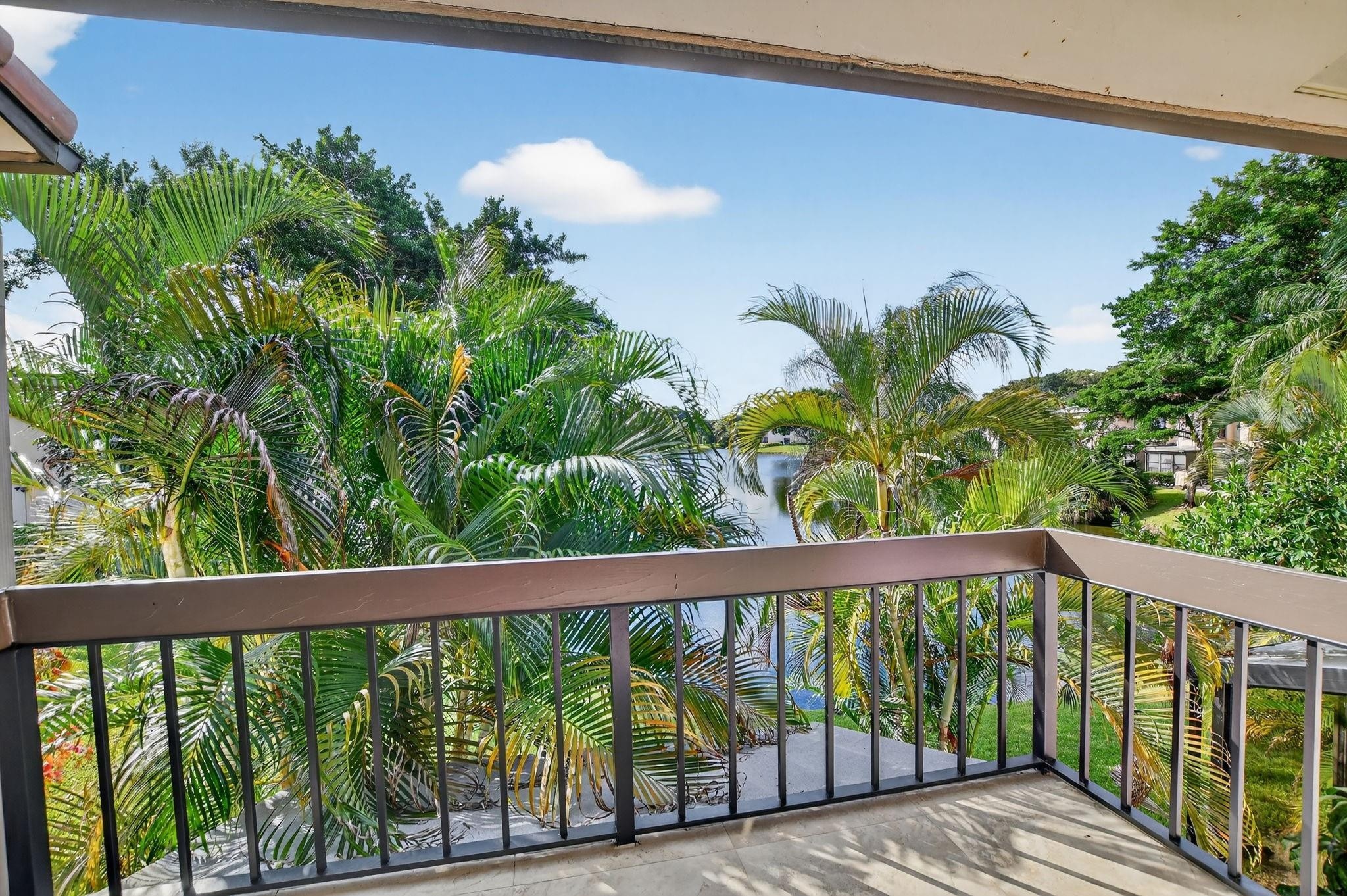 21476 Juego Circle, Unit 8C Boca Raton, FL 33433 - Photo 27 of 54 a view of a balcony with a plant