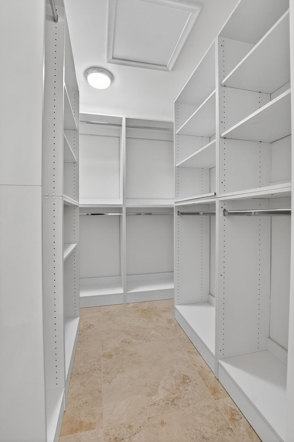 21476 Juego Circle, Unit 8C Boca Raton, FL 33433 - Photo 30 of 54 a view of an empty walk in closet