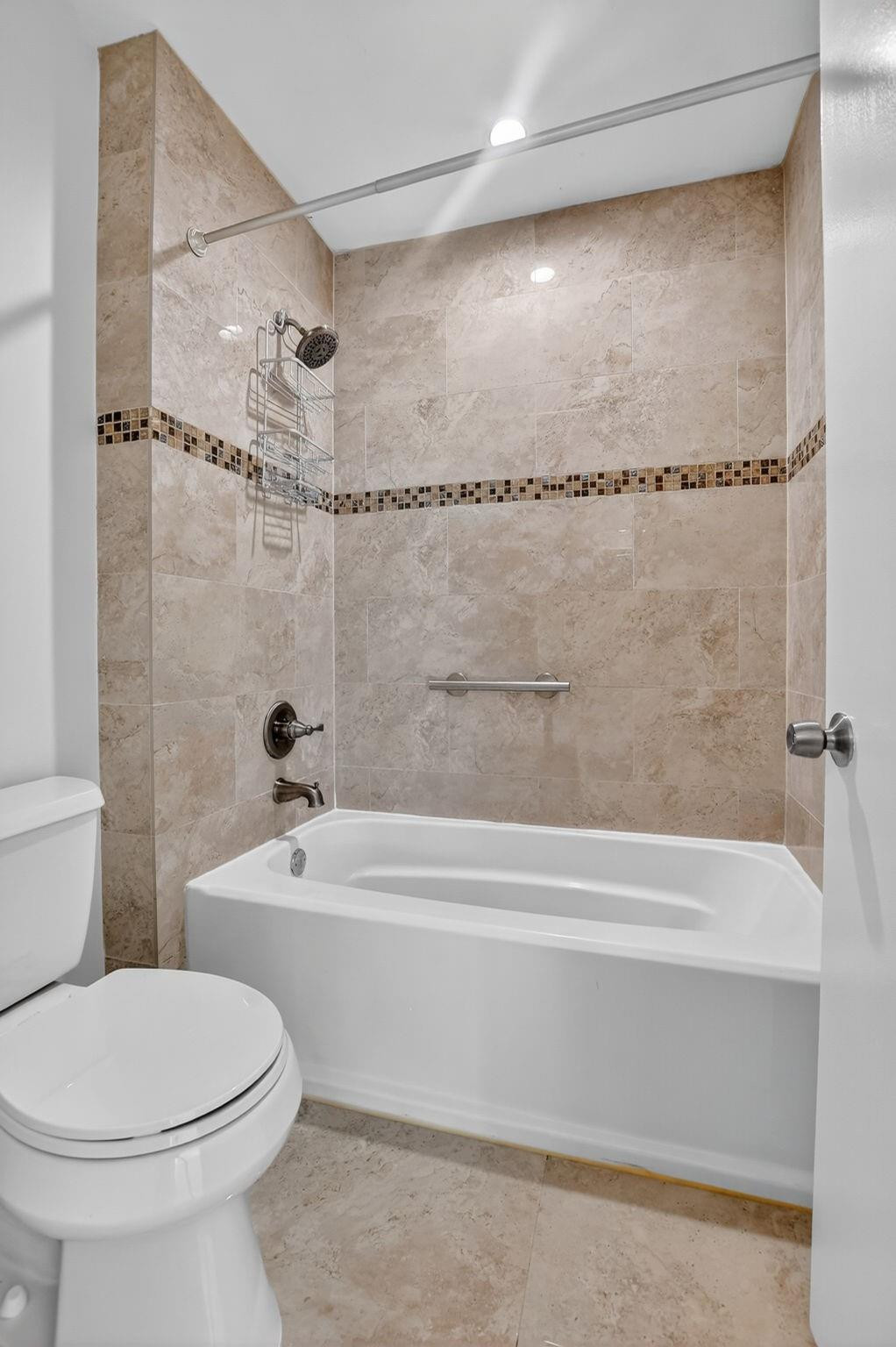 21476 Juego Circle, Unit 8C Boca Raton, FL 33433 - Photo 31 of 54 a bathroom with a toilet and a bathtub