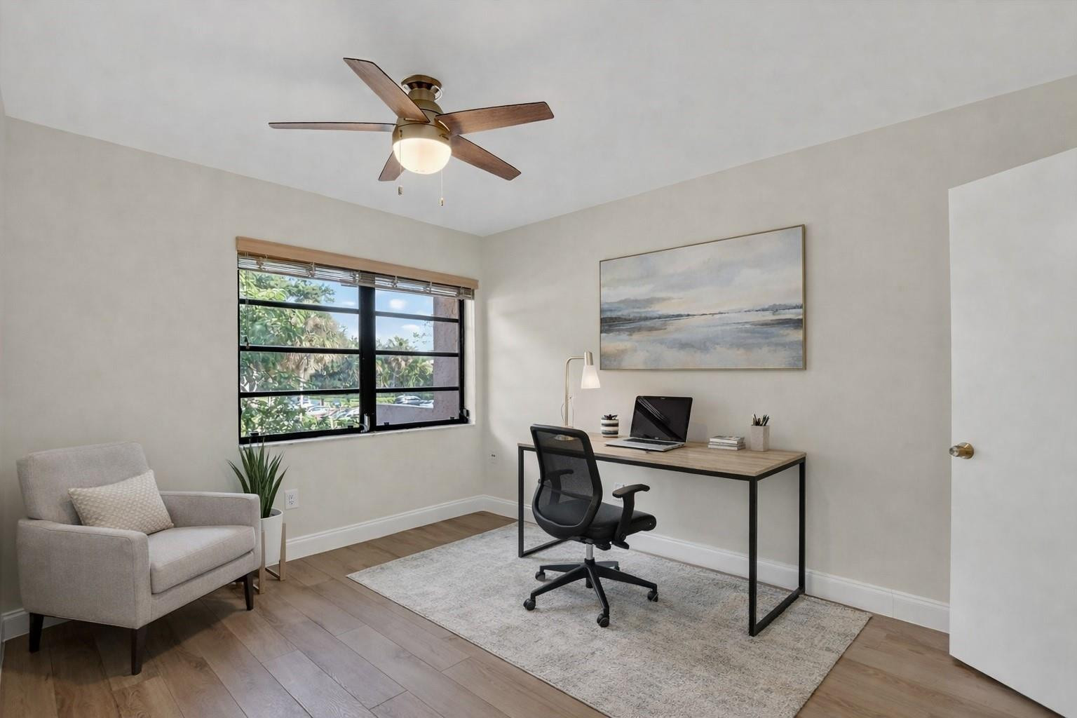 21476 Juego Circle, Unit 8C Boca Raton, FL 33433 - Photo 32 of 54 a view of a livingroom with workspace and a couch